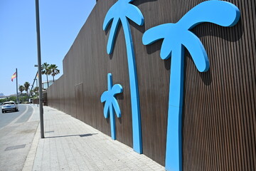 Building Wall Decorated with Blue Palm Tree Motifs © Miroslaw