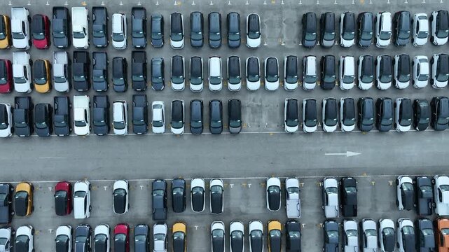 This EV car awaits shipping. Each EV car gets loaded. The EV car goes overseas.