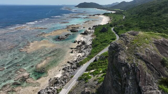 Aerial drone shot of Kumaya Cave on Iheya Island, Okinawa. A sacred power spot and legendary site of the Japanese 'Amano-Iwato' myth.