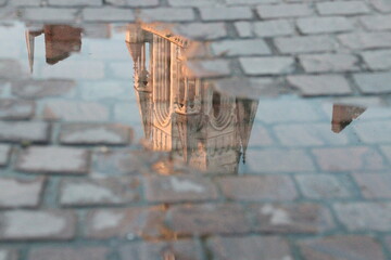 reflection of a church (st nicolas basilica) in a puddle in nantes in france  © frdric