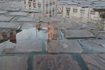 reflection of a church (st nicolas basilica) in a puddle in nantes in france  © frdric