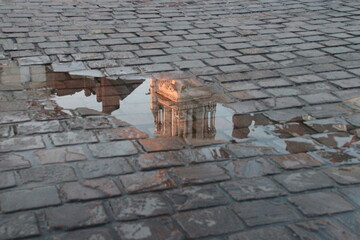 reflection of a church (st nicolas basilica) in a puddle in nantes in france  © frdric