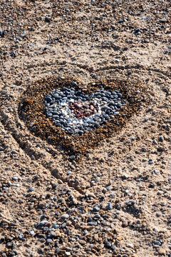 Heart constructed of pebbles on the beach