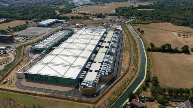 Aerial View of Hyperscale Data Center with Rows of Industrial Chillers and Server Cooling Units in the UK