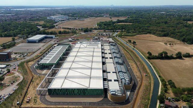 Aerial View of Hyperscale Data Center with Rows of Industrial Chillers and Server Cooling Units in the UK