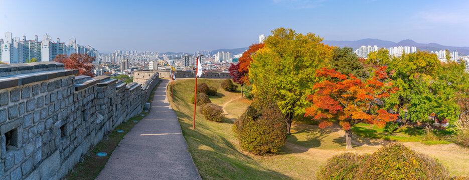 View of city wall from Seoilchi (castle) overlooking Suvon city during daytime from Paldal Park in autumn, Paldal-gu, Suwon-si, Gyeonggi-do, South Korea