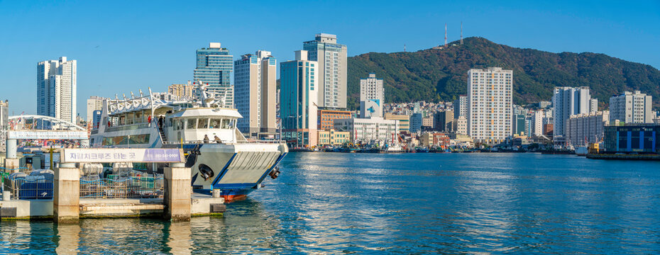 View of city skyline and bay near Jagalchi Market on a sunny day, Jung-gu, Bupyeong-dong, Busan, South Korea