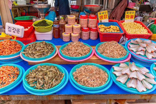 View of fish in Haean Market at Chungmudong on street with signs on a sunny day, Chungmu-daero, Seo-gu, Busan, South Korea