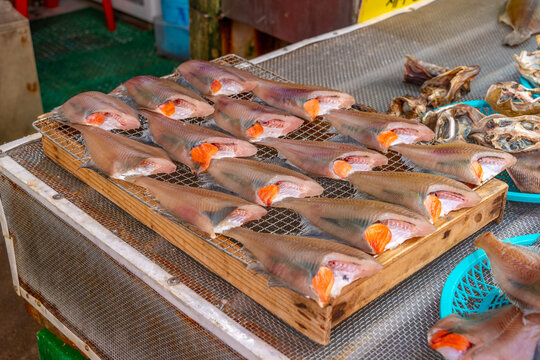 View of fish in Haean Market at Chungmudong on street with signs on a sunny day, Chungmu-daero, Seo-gu, Busan, South Korea