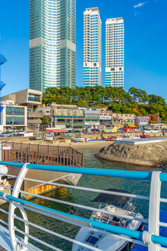 View of small beach and buildings from Songdo Cloud Trails on a sunny day, Busan, South Korea
