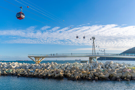 View of Songdo Cloud Trails and Songdo Cable Car in background on a sunny day, Busan, South Korea