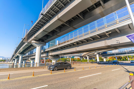 View of Gwangan Bridge and city skyline during on a sunny day, Suyeong-gu District, Busan, South Korea