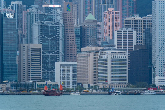 View of Hong Kong skyline and red sail junk boat from Kowloon during daytime, Kowloon, Hong Kong, China