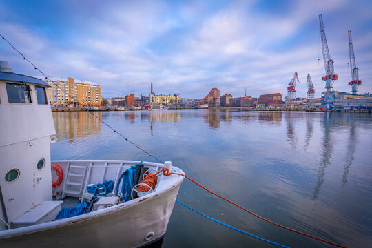 View of fishing boat and buildings around Helsinki Port, Helsinki, Finland