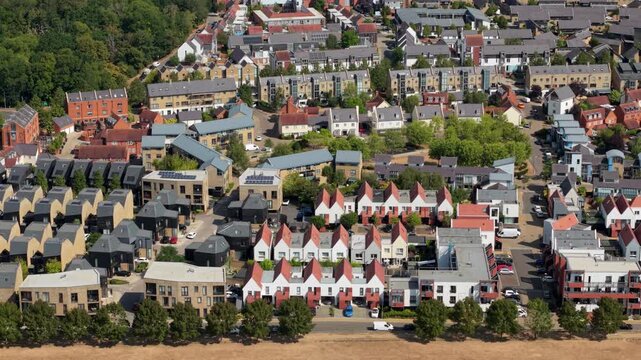 Aerial view of modern architectural residential housing estate and geometric rooftops in Harlow Essex UK