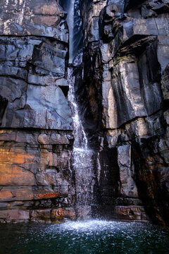 View of the waterfall cascading down the Warton Sandstone cliffs at King George Falls in the Kimberley region of Western Australia