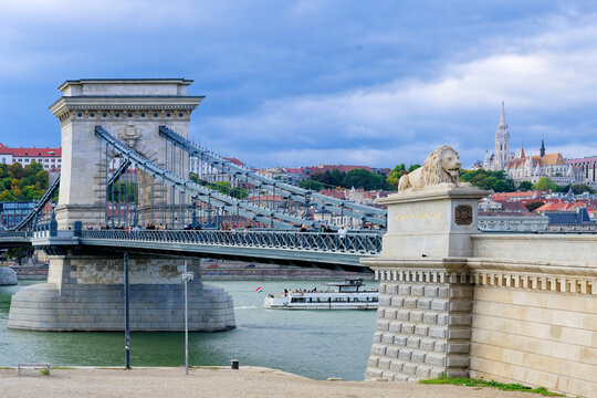 View of Chain Bridge with Fisherman's Bastion in the background, capturing the iconic structures and the river in Budapest Hungary