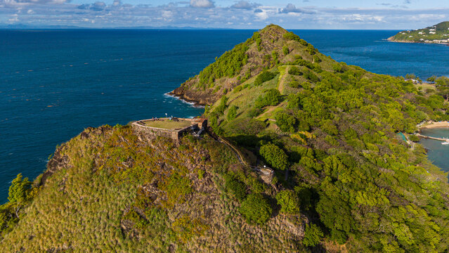 View of Fort Rodney on Pigeon Island surrounded by sea and greenery with hills and coastline visible from above in Saint Lucia