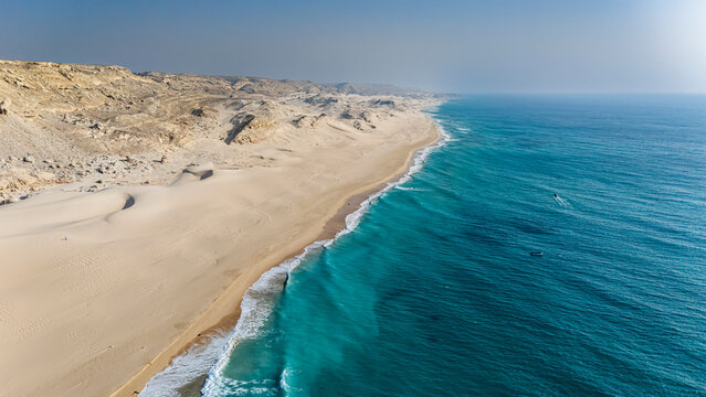 Sand dunes meet the Indian Ocean along the coastline of Puntland in Somalia