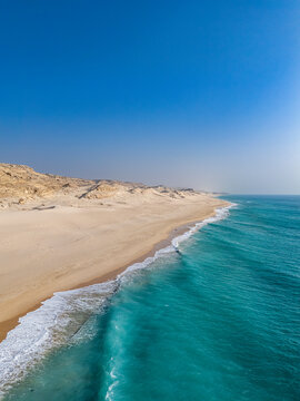 Vast sand dunes meet the Indian Ocean along a remote coastline in Puntland, Somalia