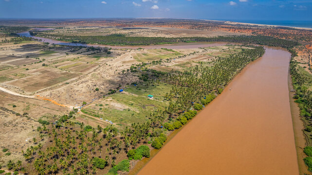 Aerial view of the Juba river with surrounding fields and vegetation in Jubaland region in Somalia