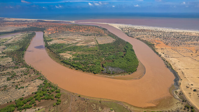 Aerial view of the Juba river winding through the landscape in Jubaland, Somalia with land and water detail