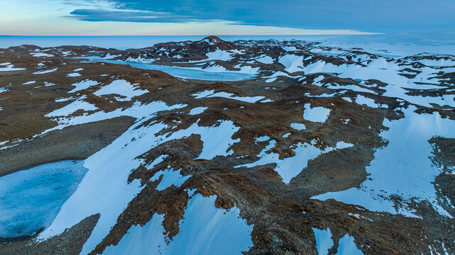Aerial of a rocky island and frozen lakes, Queen Maud Land, Antarctica