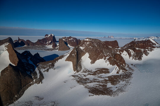 Mountain tops peeking out of the glaciers of Queen Maud Land, Antarctica