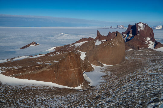 Mountain tops peeking out of the glaciers of Queen Maud Land, Antarctica