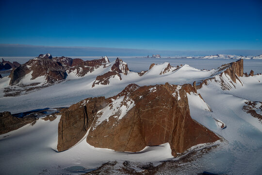 Mountain tops peeking out of the glaciers of Queen Maud Land, Antarctica