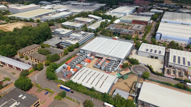 Aerial view of data center roof chiller units and industrial cooling fan banks in the UK