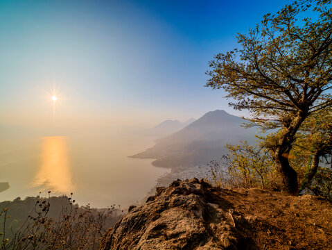 View from Rostro Maya or Indian Nose over Lake Atitlan and San Juan La Laguna towards San Pedro Volcano at sunrise, Solola Department, Guatemala