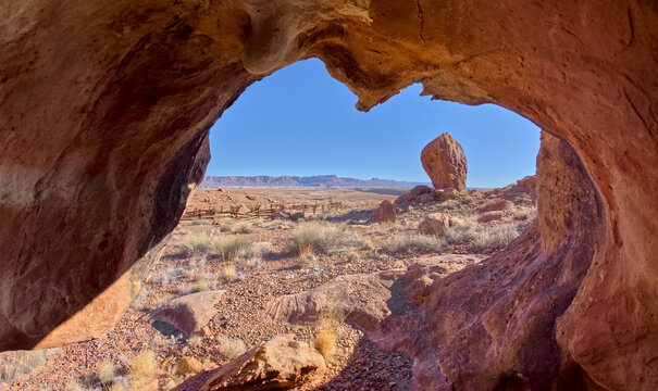 View from inside a hollowed boulder at Vermilion Cliffs National Monument in Arizona offering a unique sight to visitors