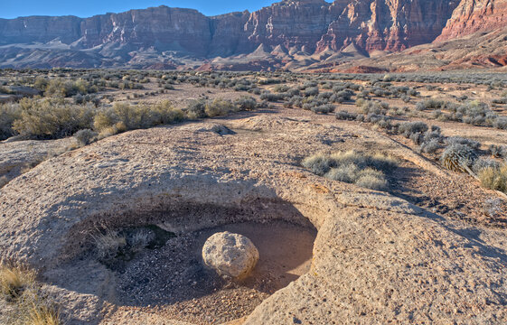 Stone bowl on Soap Creek Mesa with Paria Plateau in the background at Vermilion Cliffs National Monument in Arizona