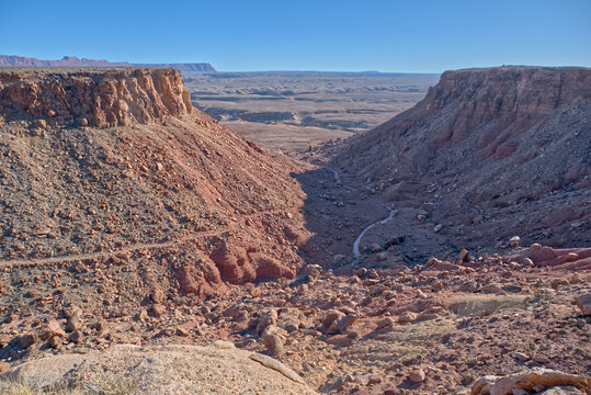 Unmaintained trail winds up a canyon slope from Soap Creek Mesa at Vermilion Cliffs National Monument in Arizona