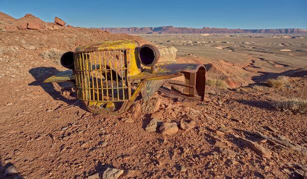 Automotive relics rest on rocky terrain near the Sun Valley Mine Trail in Arizona