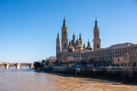 Panoramic view of Basilica del Pilar and Ebro River during sunset in Zaragoza, Spain