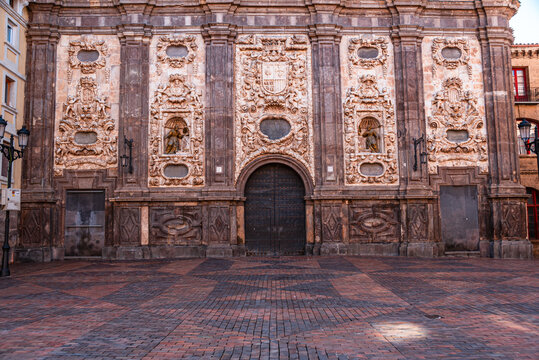 Baroque facade of the Church of Santa Isabel de Portugal in Zaragoza features intricate designs and sculptures in a historic setting