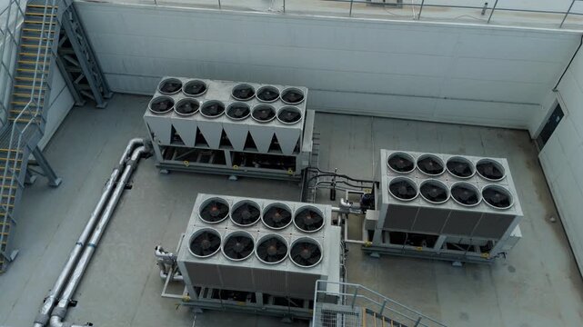Aerial Detail of Rooftop Industrial Air Conditioning Units and Chillers on data center roof Facility