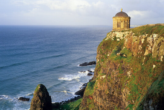 Mussenden Temple overlooks the Atlantic Ocean on a cliff edge in County Londonderry, capturing the beauty of Northern Ireland's coastline