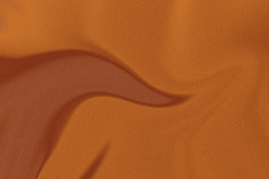 Abstract dark brown and gold wave background with grain