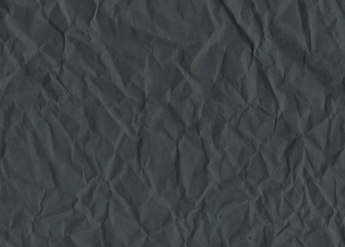 Crumpled black paper background. Wrinkled paper frame canvas for design. Black drawing board material.	