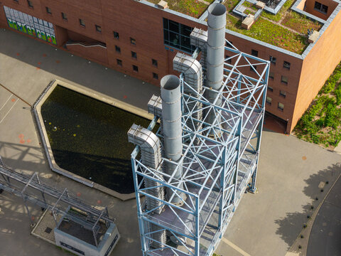 Aerial view of the industrial chimneys and metal structure of the Centrum Nauki i Techniki EC1 in the red brick complex in Lodz, Lodz Voivodeship, Poland.