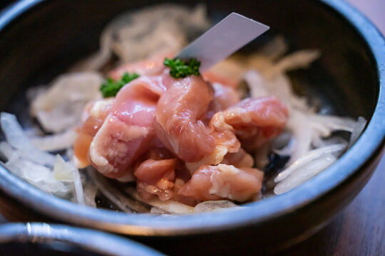 A hotpot meat platter presents thinly sliced beef, pork, and chicken arranged neatly on a serving plate. Close-up compositions emphasize beef marbling, pork color, and the natural fiber patterns of ch