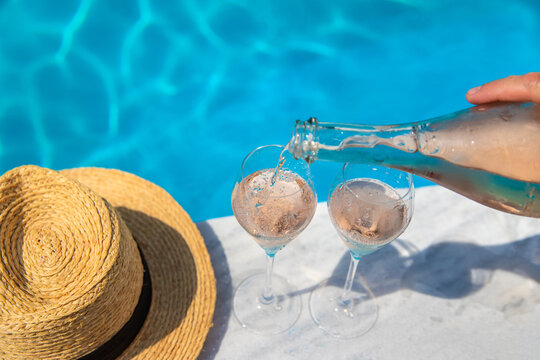 Champagne by the pool. Selective focus.