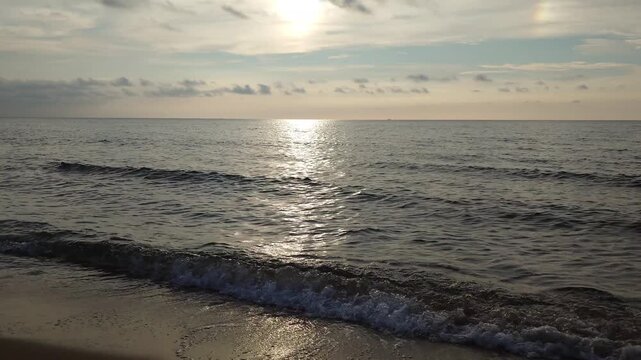Peaceful afternoon sea with gentle waves at Kotogahama Beach, Shimane, Japan