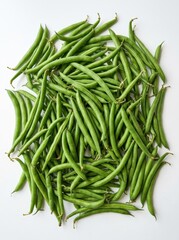 Fototapeta premium Fresh Organic Green Beans Pile Isolated on White Background - Healthy Raw String Beans for Cooking and Nutrition
