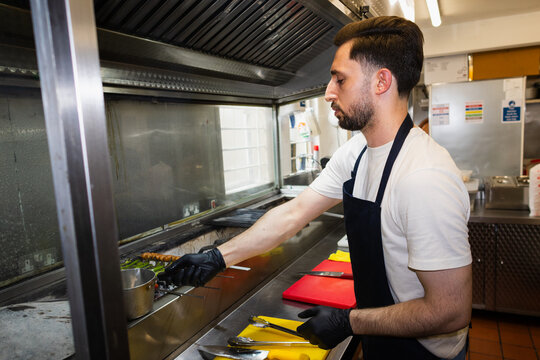 Chef tending the grill station