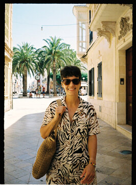 Person enjoying sunny vacation street in Mallorca, Spain