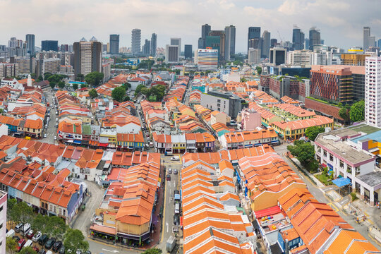 Traffic on roads between row hoses with terracotta tiled roofs